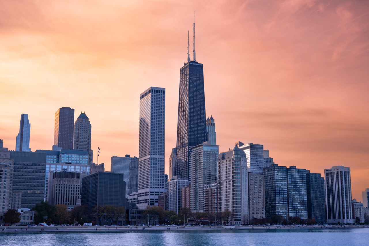 Chicago skyline along the river at dusk